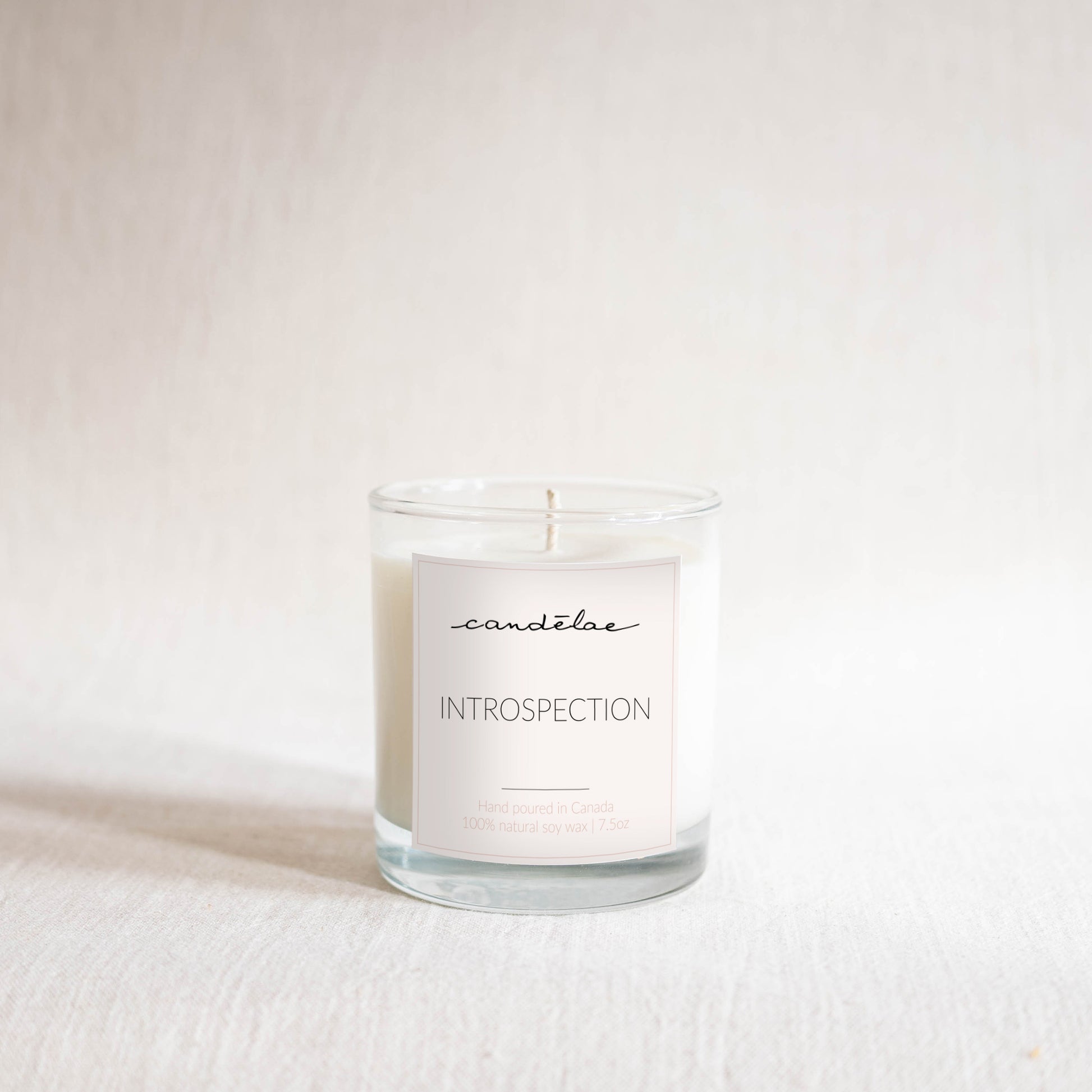 Introspection candle from candēlae is set with a white background for Photoshoot