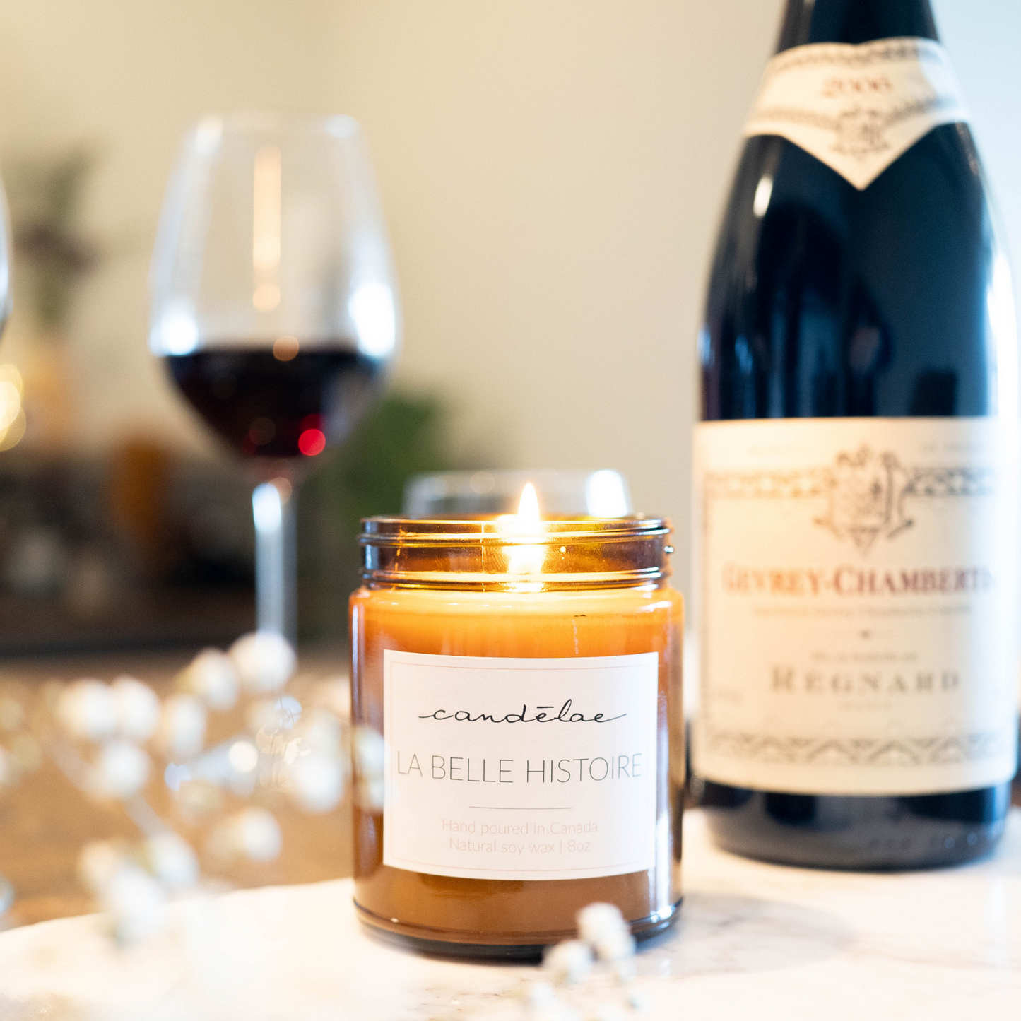 La belle histoire is at the center of the table for Valentine's Day next to a bottle of French wine